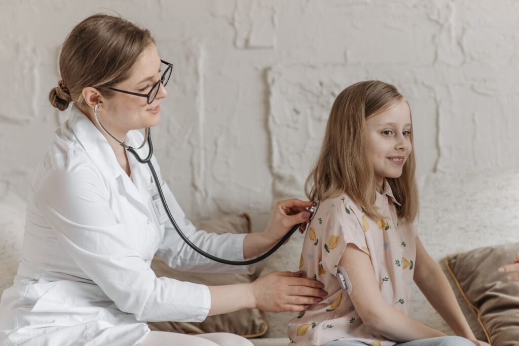 Mastering the First Impression: Your intriguing post title goes here A doctor uses a stethoscope during a check-up with a young girl in a medical setting.